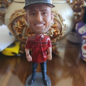 Red and Black Bobblehead Figurine